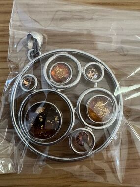 Silver Circular Pendant Necklace with Amber Accents